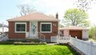 Our new house, pre-renovation. 1960s bungalow on a large 60x160 lot - prime location just steps from the lake.