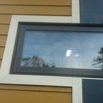 Close up of where the HardiePlank siding & HardiePanels meet at the window.