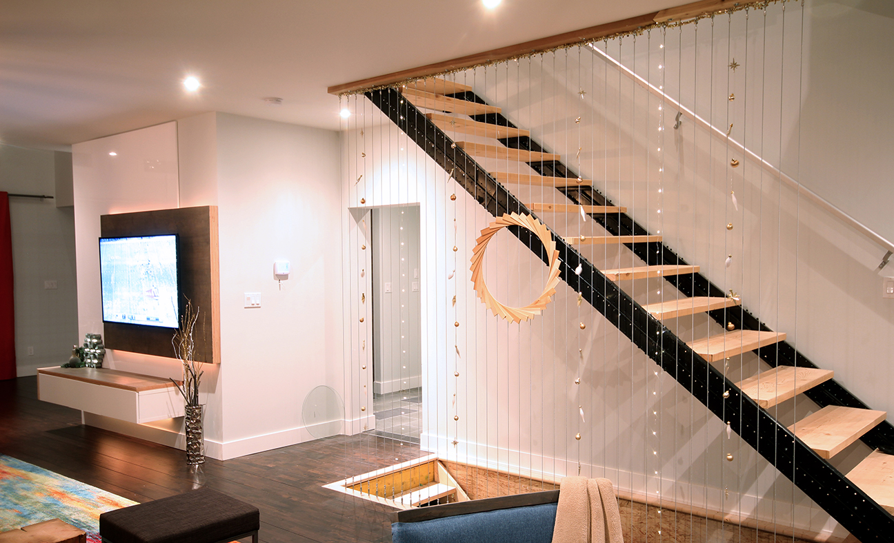 Dreamhouse Project modern industrial stairs decorated with ornament garlands & wooden wreath