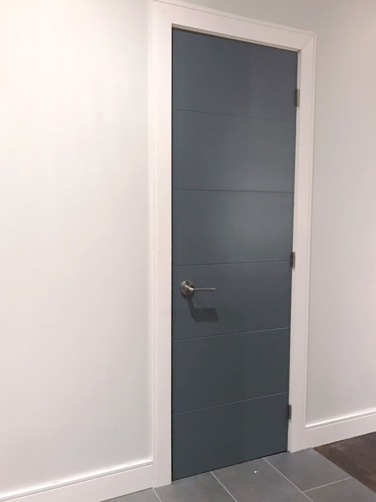 Our upgraded powder room door - Melrose Moulded Panel Door from Metrie painted in PARA 'Mama's Boy'