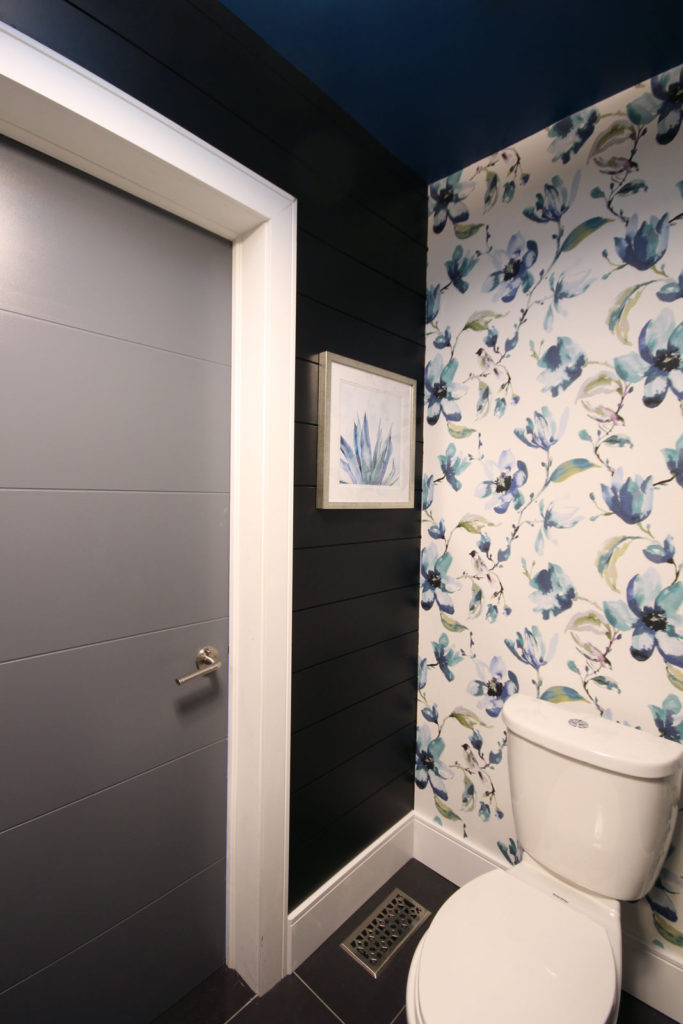 Love how our DIY fabric wallpaper contrasts beautifully against our black shiplap walls & modern door; both from Metrie